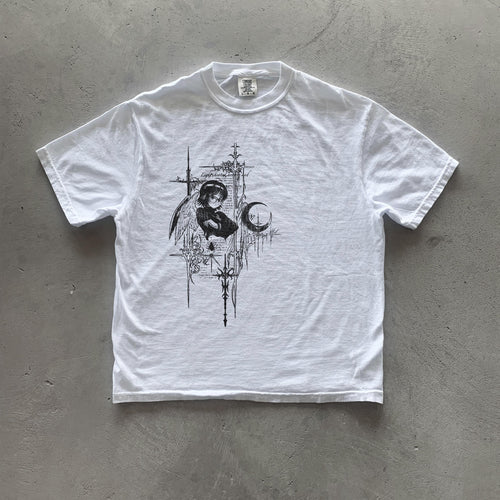 May include: White t-shirt with a black and white graphic print of a person with wings and a crescent moon. The graphic is surrounded by a design of crosses and other symbols. The text 'Light Within' is visible on the graphic.